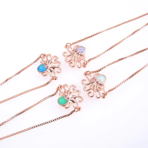 Colgantes de pulpo en oro rosa con piedras de opalo de colores y cadenas box
