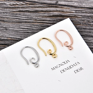 U-shaped gold and silver earring hooks with spiral wire detail for DIY jewelry making