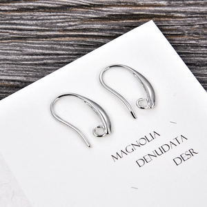 Macro detail of polished silver U-shape earring hooks for DIY jewelry making craft