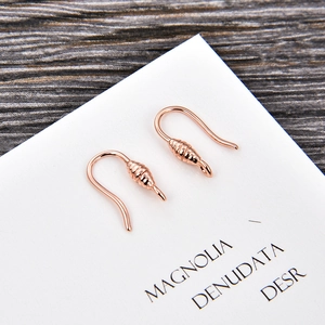 Macro view of rose gold U-shaped earring hooks for DIY jewelry making accessories
