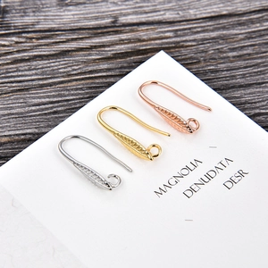 Engraved gold, silver, and rose gold U-shaped ear hooks with textured leaf detail