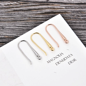Detailed view of S925 sterling silver DIY U-shaped earring hooks in gold and silver