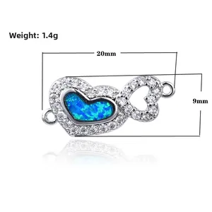 Vue détaillée du connecteur coeur infini avec opale bleue et pierres de zircon