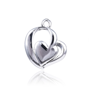 Polished silver double heart pendant featuring a hollow frame and solid inner heart design