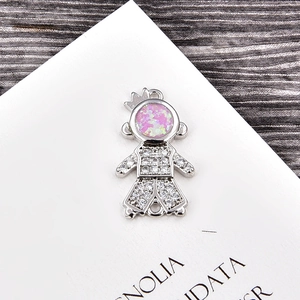 Macro shot of silver crown pendant with pink opal and white cubic zirconia for DIY jewelry