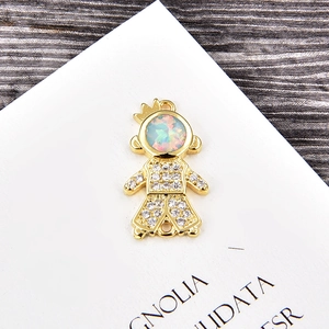 Detail of Little Prince gold pendant with round opal and white cubic zirconia pave