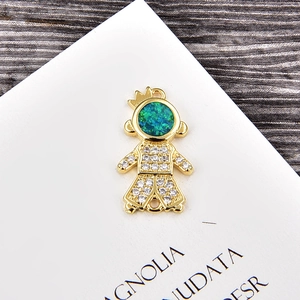 Detailed view of a gold prince pendant with blue opal head and white zircon inlay