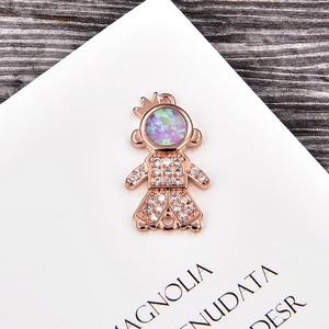 Macro view of rose gold astronaut connector with opal stone and zircon for DIY jewelry