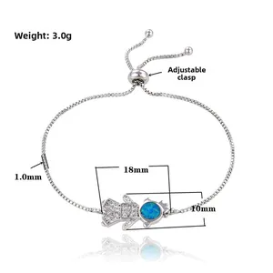 Detailed view of silver adjustable box chain bracelet with blue opal cartoon girl pendant