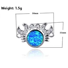 Detailed macro view of 16x11mm crab charm with blue opal and cubic zirconia stones