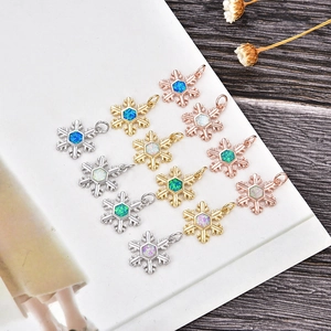 Detailed collection of snowflake pendants with colorful opal stones in various metal finishes
