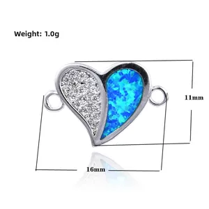 Detail of heart charm with white zircon and blue opal inlay, size 16mm x 11mm