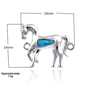 Detail of silver horse pendant with blue opal inlay showing dimensions 18mm by 14mm