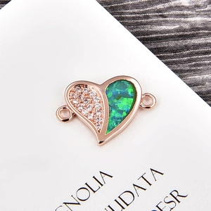Macro detail of heart-shaped opal and zircon connector for DIY bracelet making