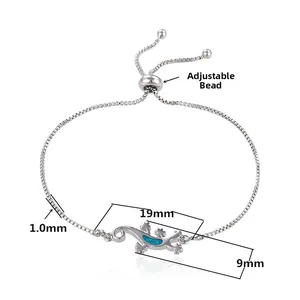 Detail of adjustable silver gecko bracelet with blue opal inlay and dimensions 19x9mm
