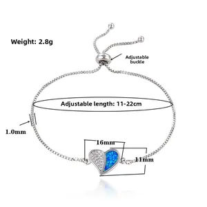 Detailed view of silver heart bracelet with opal and zircon showing 16mm pendant size
