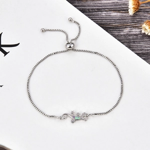 Macro view of silver gecko bracelet with opal inlay and adjustable bolo slider clasp