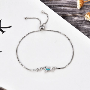 Detail of lizard bracelet with blue opal inlay, adjustable slider bead and box chain