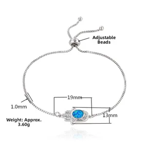 Detailed view of silver Hamsa Hand bracelet with blue opal and zircon, 19x13mm size