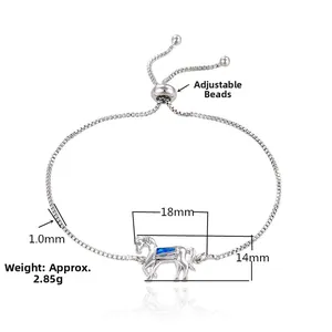Detail of horse-shaped bracelet featuring a blue opal inlay and adjustable sliding clasp