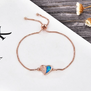 Rose gold heart bracelet detail with zircon opal inlay and adjustable box chain slide