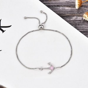 Detail of silver anchor bracelet with pink opal inlay and adjustable slider closure