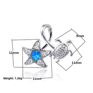 Macro shot of silver turtle and starfish pendant with blue opal and measurements