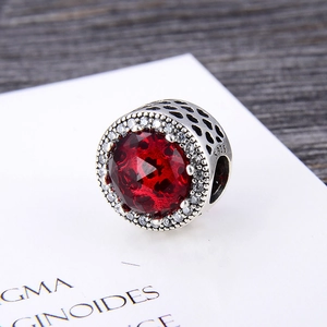 S925 sterling silver charm with large red zirconia stone and heart cut-outs