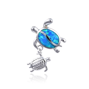 Polished silver double sea turtle pendant with blue opal shell inlay and zircon accents