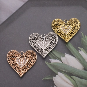 Hollow bird nest heart pendants with micro-set diamonds in gold, silver, and rose gold