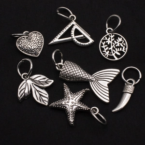 Set of 7 vintage silver alloy charms featuring heart, ruler, and starfish for DIY jewelry