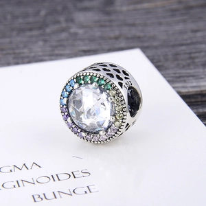 Macro shot of S925 sterling silver bead with colorful zircons and hollow heart details