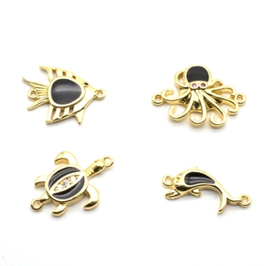 Golden sea animal charms including turtle and dolphin with black enamel for jewelry making