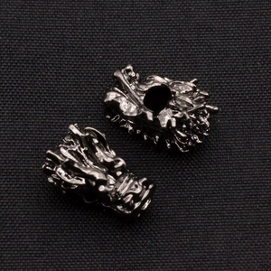 Macro detail of gunmetal dragon head alloy beads for DIY jewelry and bracelets