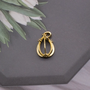 Detail of gold waterdrop hollow pendant base with mini zircons for pearl DIY crafts