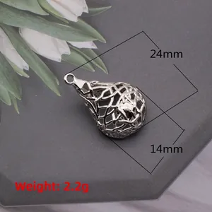 Detailed macro view of silver teardrop hollow pendant measuring 24mm x 14mm for DIY jewelry