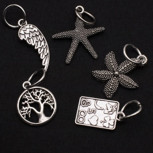 Vintage alloy charm set featuring angel wings, starfish, and tree of life for DIY jewelry