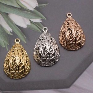 Detailed view of teardrop heart-nest pearl pendants in gold, silver, and rose gold finishes