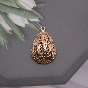Close-up of heart bird nest gold pendant with pearl for DIY jewelry making