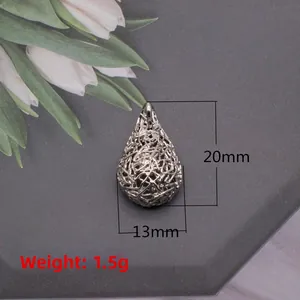 Silver hollow bird nest teardrop pendant detail with 20mm height and 13mm width dimensions