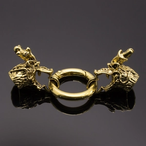 Macro detail of golden dragon head spring clasp for jewelry and creative keychains