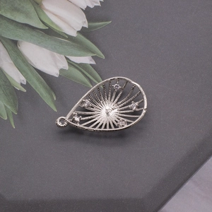 Silver teardrop pearl pendant base with radiant lines and zircon accents on grey background