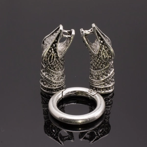 Macro detail of retro silver dragon head clasp and spring ring for DIY jewelry making