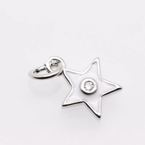Detailed view of star pendant with white enamel inlay and central round cubic zirconia