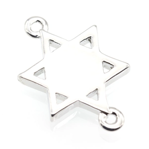 Macro detail of a polished silver star connector for DIY jewelry necklaces and bracelets