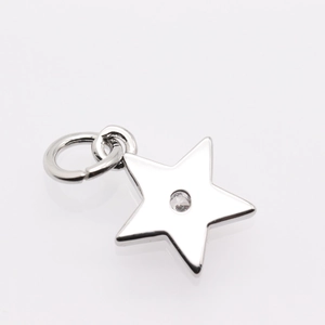 Macro view of silver star pendant with round clear zircon and open ring for DIY jewelry