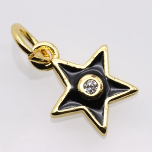Macro detail of star pendant with black enamel finish and sparkling center zircon stone