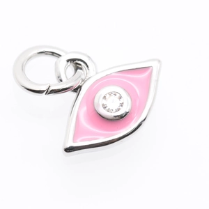 Detailed macro view of pink enamel evil eye pendant with center zircon in silver finish