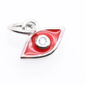 Detailed close-up of a silver-tone evil eye charm with red enamel and center crystal stone