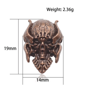 Vintage skull charm bead in red copper with dimensions 19mm x 14mm and weight 2.36g